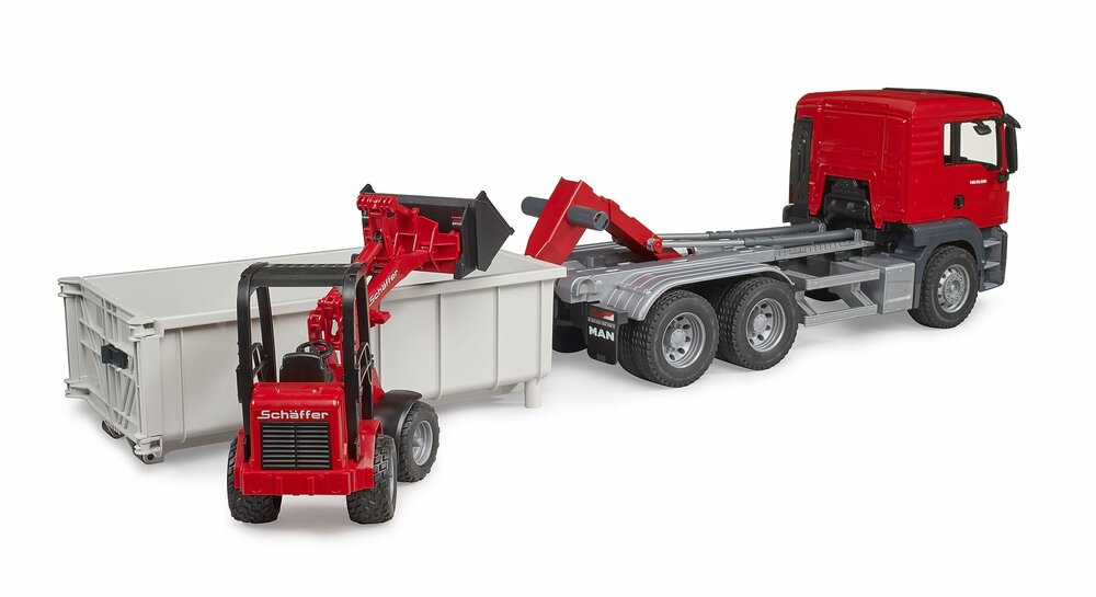 MAN TGS truck with roll-off container and Schäffer yard loader